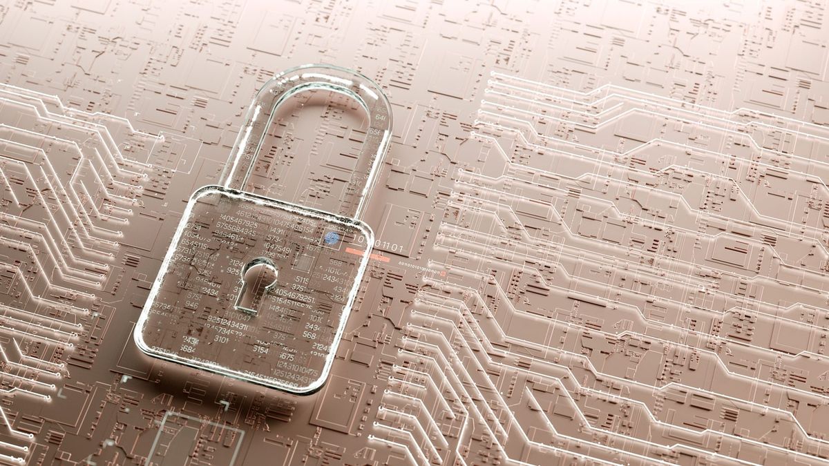 A transparent padlock resting on a circuit board.
